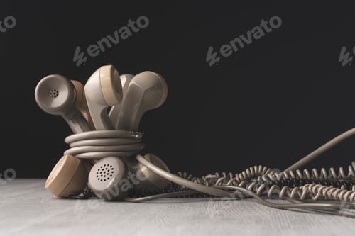 Preview: Old telephone receivers tied together