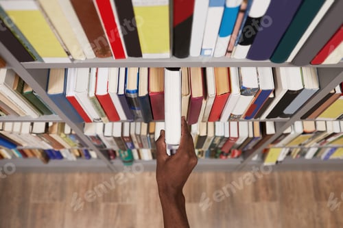 Preview: Student Taking Book in Library Closeup