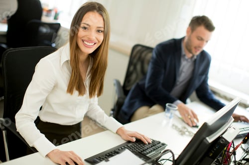 Preview: Young businesspeople working in modern office