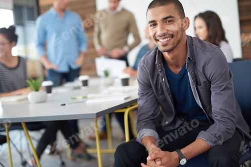 Preview: Hes a cut above the rest. Shot of a handsome young man sitting in a meeting.