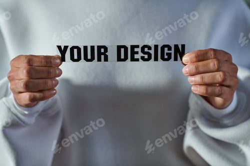 Preview: Cropped view of african american craftswoman in sweatshirt holding printing layer with your design