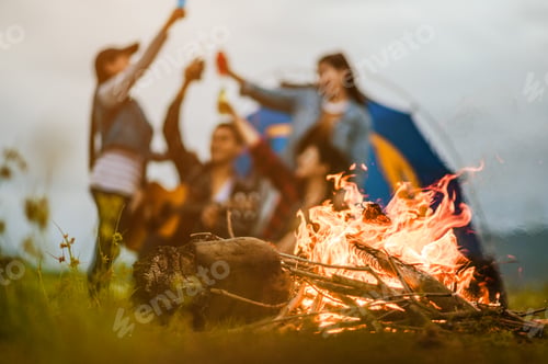 Preview: Camping tent camp in nature happy young Asian friends group in night party bonfire and the man playi