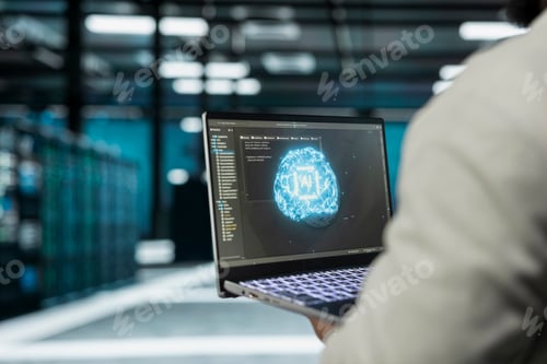 Preview: Close up of data center programmer using AI software on laptop