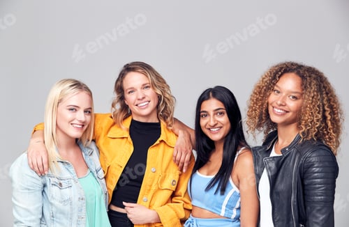 Preview: Group Studio Portrait Of Multi-Cultural Female Friends Smiling Into Camera Together