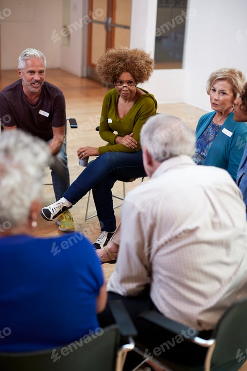 Preview: People Attending Self Help Therapy Group Meeting In Community Center