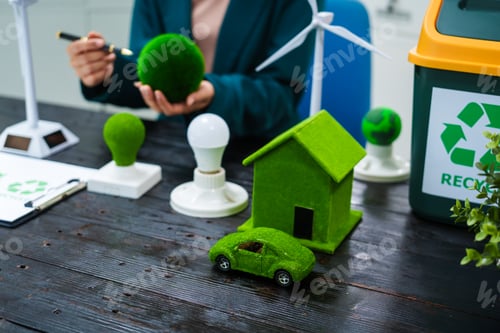 Preview: An Asian businesswoman sits at her desk, discussing clean energy solutions their impact on homes