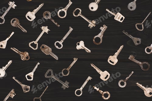 Preview: top view of different metal keys on black table