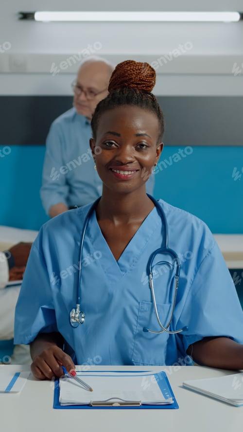 Preview: Close up of woman working as nurse sitting at desk