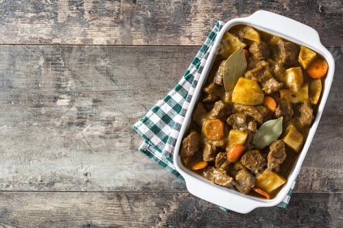 Preview: Delicious beef stew with potatoes and carrots warming on rustic wooden table