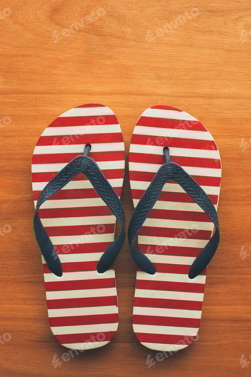 Preview: Beach sandals flip flops on wooden background