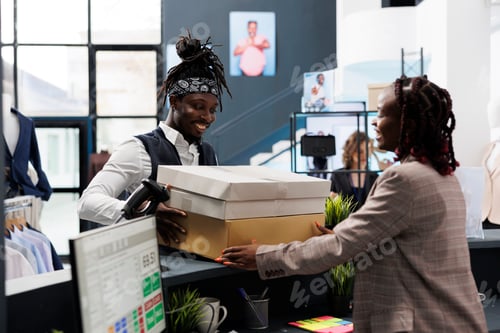 Preview: African american shopper holding packages