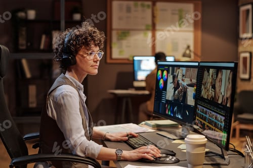 Preview: Woman working with multimedia software