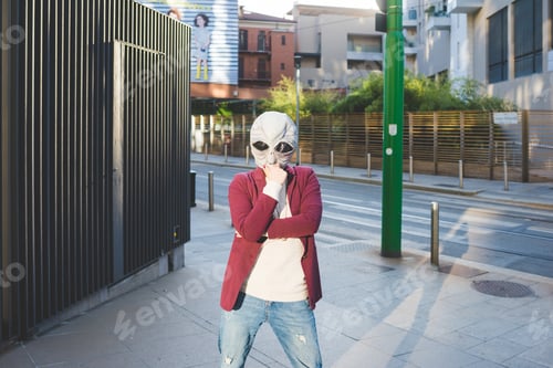 Preview: Woman wearing alien mask