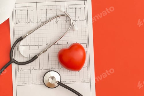 Preview: Stethoscope and heart on the background of the cardiogram. Top view. Flat lay. Medicine concept.