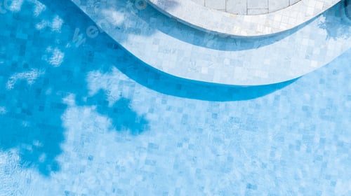 Preview: Top view swimming pool blue water in summer with umbrella pool and deck beach