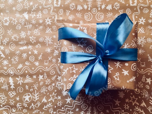 Preview: Christmas Gift Wrapped in Festive Paper with Ribbon