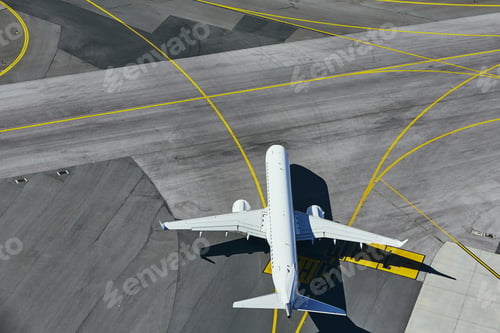 Preview: Aerial view of the airport. Airplane taxiing to runway.