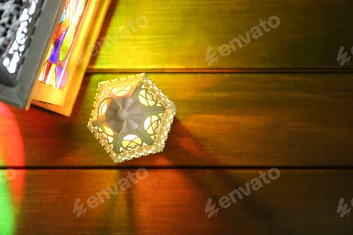 Preview: Decorative Arabic lanterns on wooden table, flat lay. Space for text