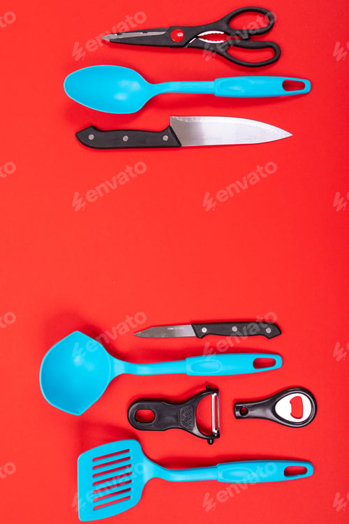 Preview: top view of stylish kitchen utensils isolated on red background