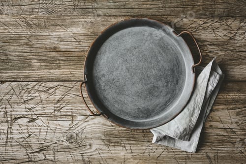 Preview: Empty metal tray on a old wooden table
