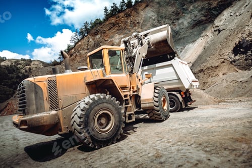 Preview: Wheel loader bulldozer with backhoe loading dumper trucks on construction site