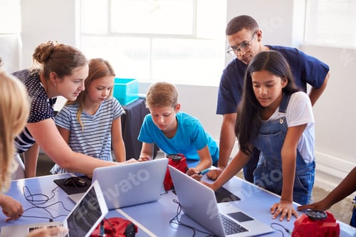 Preview: Group Of Students In After School Computer Coding Class Learning To Program Robot Vehicle
