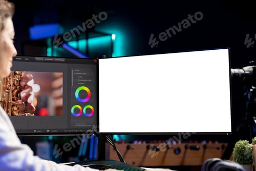 Preview: Post production studio employee working with raw footage on mockup PC