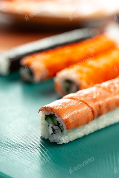 Preview: Preparing sushi rolls with fresh ingredients at a culinary studio