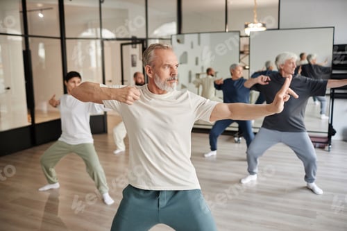 Preview: Senior Qigong Class Students Standing in Archer Position