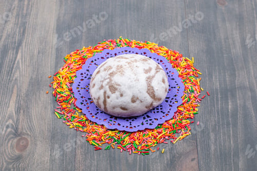 Preview: Pile of colorful sprinkles around sweet cookie
