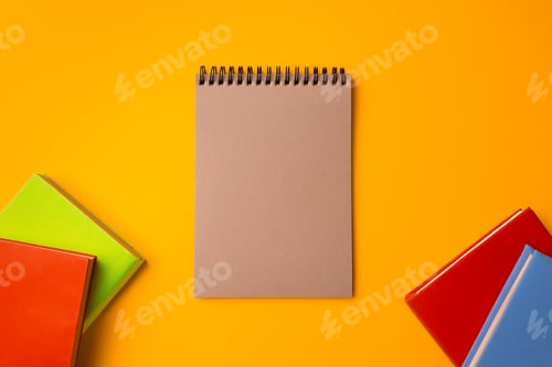 Preview: Hardcover notepads on yellow background top view