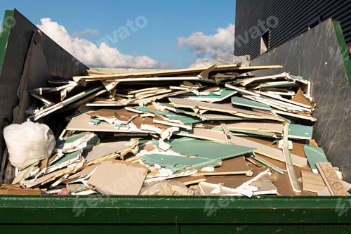 Preview: Garbage container full of drywall chunks