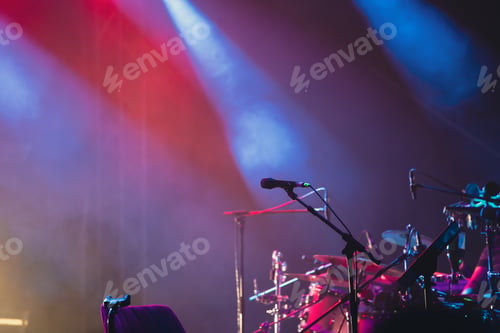 Preview: Colorful stage lights and microphone at concert