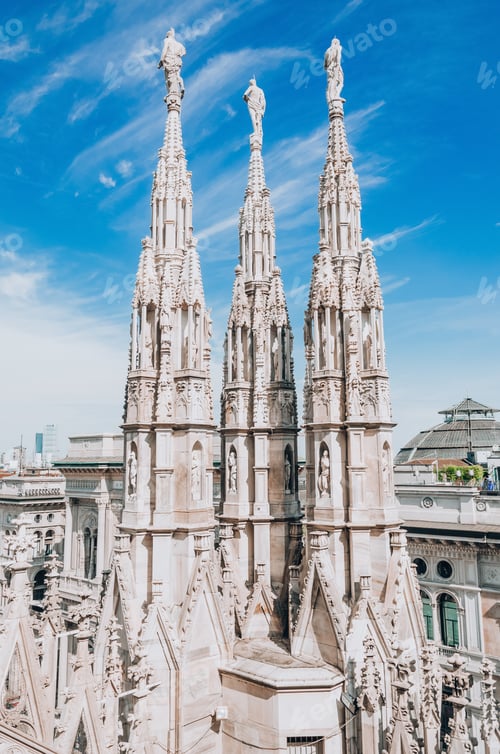 Preview: Roof of Milan Cathedral Duomo di Milano with Gothic spires and white marble statues.