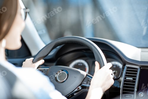 Preview: Woman driving a car