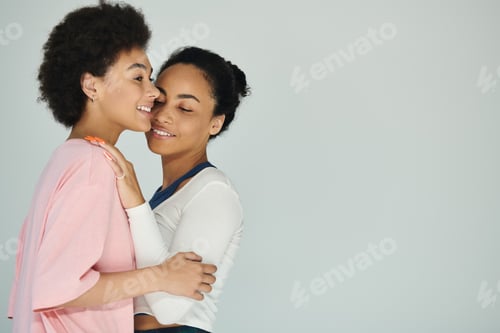 Preview: Intimate moment between two women celebrating love and connection in a serene setting