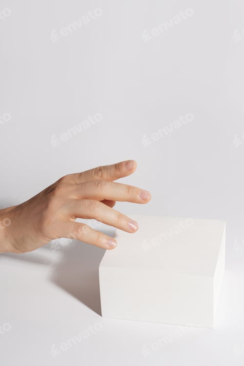 Preview: Female hand and luxury white block pedestal for product showcase