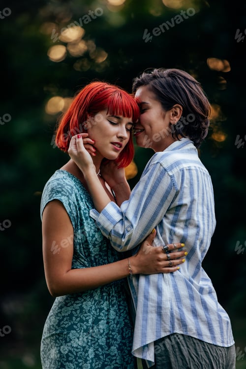Preview: Focus on two lesbian girls, sharing love, standing in front of each other.