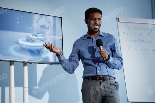 Preview: Smiling Black Man Speaking on AI Technologies at Business Conference