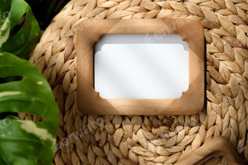 Preview: mockup wood photo frame on wicker stood with monstera with sunlight