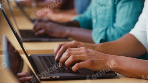 Preview: Close Up Of Multi-Cultural Business Team Typing On Laptop Computer Keyboard In Modern Office