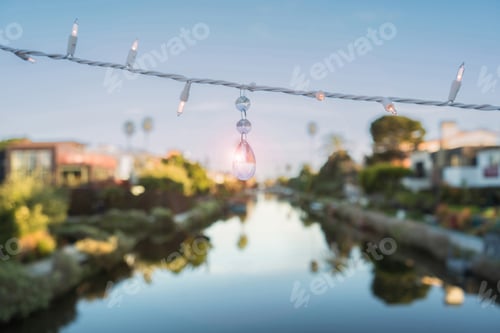 Preview: A string of lights hangs above a body of water at Venice Beach, California