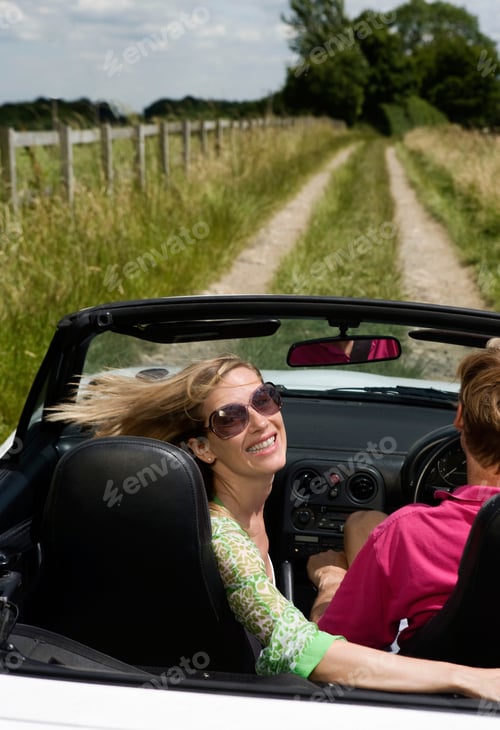 Preview: Couple in convertible car