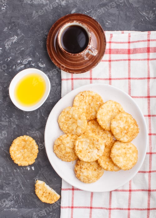 Preview: Traditional japanese rice chips cookies with honey and soy sauce on a white ceramic plate