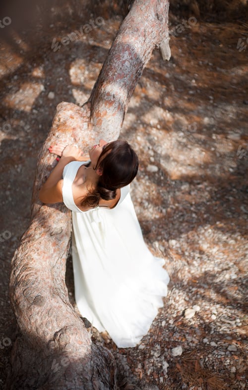 Preview: Beautiful young woman in white dress