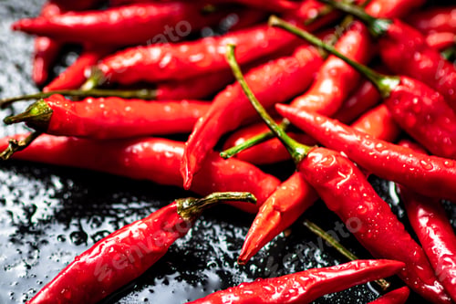 Preview: Pods of hot chili peppers on the table.