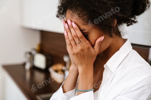 Preview: Young black woman being upset and thinking about abortion at home