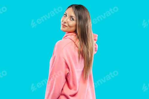 Preview: Woman wearing pink sweatshirt turned on her back on studio