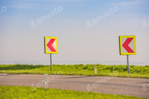 Preview: Turn left sign on a country road