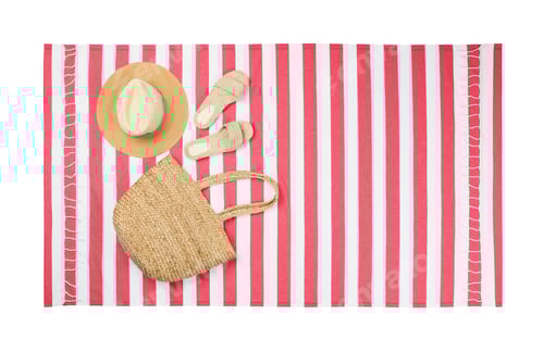 Preview: Striped beach towel with slippers, straw hat and bag on white background, top view
